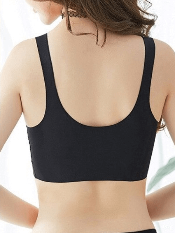 Back view of a seamless solid color women's sports bra in black, ideal for fitness, showcasing adjustable straps.